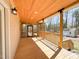Back porch with wood ceiling and flooring, screened porch to the left, and a lovely yard view at 1220 E Middleton Dr, Creedmoor, NC 27522