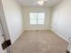 Neutral bedroom featuring carpet and window providing natural light at 1220 E Middleton Dr, Creedmoor, NC 27522