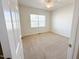 Bedroom features neutral walls, carpet, and natural light from a window at 1220 E Middleton Dr, Creedmoor, NC 27522