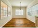 Bright dining area featuring a chandelier and several windows for abundant natural light at 1220 E Middleton Dr, Creedmoor, NC 27522