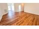 Sunlit entryway featuring wood flooring and a view into the next room at 1220 E Middleton Dr, Creedmoor, NC 27522