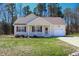 Charming single-Gathering home featuring a well-manicured lawn and attached one-car garage at 1220 E Middleton Dr, Creedmoor, NC 27522
