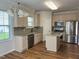 Well-equipped kitchen boasting granite countertops, stainless steel appliances, and central island at 1220 E Middleton Dr, Creedmoor, NC 27522