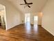 Spacious living room showcasing the stainless steel kitchen appliances and an open floor plan at 1220 E Middleton Dr, Creedmoor, NC 27522