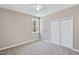 Neutral bedroom with carpet flooring, a window, and closet doors at 133 Mohawk Dr, Louisburg, NC 27549