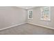 Neutral bedroom with carpet flooring, natural light, and views of the surrounding landscape at 133 Mohawk Dr, Louisburg, NC 27549