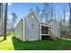 Charming home with a screened in porch and wooden steps in a lush green yard at 133 Mohawk Dr, Louisburg, NC 27549