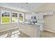 Modern kitchen featuring granite countertops, stainless appliances, and lots of natural light at 133 Mohawk Dr, Louisburg, NC 27549