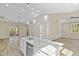 Bright, modern kitchen featuring granite countertops, pendant lights, and stainless appliances at 133 Mohawk Dr, Louisburg, NC 27549