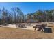 A spacious picnic area with multiple wooden picnic tables, perfect for outdoor gatherings and community events at 133 Mohawk Dr, Louisburg, NC 27549