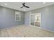 A screened in porch has a ceiling fan and sliding glass door at 133 Mohawk Dr, Louisburg, NC 27549