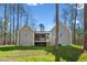 The rear exterior features a screened-in porch with steps down to the backyard at 133 Mohawk Dr, Louisburg, NC 27549
