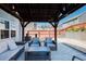 Relaxing backyard patio with cozy seating and an inviting pergola for outdoor enjoyment at 1403 Copper Cir, Mebane, NC 27302
