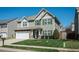 Charming two-story home with a well-manicured lawn and attached two-car garage, offering curb appeal at 1403 Copper Cir, Mebane, NC 27302