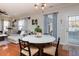 Bright living room with a marble table, hardwood floors, and natural light at 1403 Copper Cir, Mebane, NC 27302