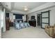 Large main bedroom suite with tray ceilings, wood accent wall, and private closet entrance at 1403 Copper Cir, Mebane, NC 27302