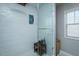 Modern shower stall with tiled walls, built-in niche, glass door and seat at 1403 Copper Cir, Mebane, NC 27302
