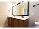 Bathroom featuring double sinks, a large mirror, and ample cabinet space at 1503 Orchard Villas Ave, Apex, NC 27502