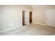 Bright bedroom with plush carpeting and 2 closet doors at 1503 Orchard Villas Ave, Apex, NC 27502