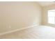 Bright bedroom with plush carpeting and a window at 1503 Orchard Villas Ave, Apex, NC 27502
