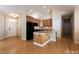 Spacious kitchen with dark appliances, granite countertops, and ample cabinet space at 1503 Orchard Villas Ave, Apex, NC 27502