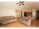 Comfortable living room with hardwood floors and a view of the open kitchen area at 1503 Orchard Villas Ave, Apex, NC 27502