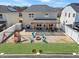 A backyard with a pergola covered patio, a green lawn, play set, and fire pit showcasing outdoor living and a well kept yard at 151 Kutter Dr, Elon, NC 27244