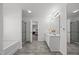 Spacious bathroom featuring double vanity, bathtub, shower with glass door, and modern fixtures at 151 Kutter Dr, Elon, NC 27244