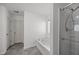 Bathroom with soaking tub, shower with glass door, and modern fixtures creating a spa-like atmosphere at 151 Kutter Dr, Elon, NC 27244