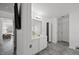 Bathroom featuring a double vanity, ample storage space, updated flooring, and modern lighting at 151 Kutter Dr, Elon, NC 27244
