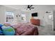 Bright bedroom with large windows, ceiling fan, updated flooring, and a vanity desk for comfortable living at 151 Kutter Dr, Elon, NC 27244