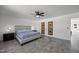 Cozy bedroom featuring modern lighting, stylish decor, a comfortable bed, and updated flooring at 151 Kutter Dr, Elon, NC 27244