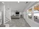 Open floor plan featuring living area with fireplace flowing to patio and stairs to upper level at 151 Kutter Dr, Elon, NC 27244