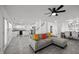 Open-concept living space with modern furnishings and seamless flow to the kitchen and dining areas at 151 Kutter Dr, Elon, NC 27244