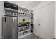 Pantry with refrigerator, shelves and a door leading to another room at 151 Kutter Dr, Elon, NC 27244