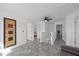 Open upper level area with gray floors and doors leading to bedrooms at 151 Kutter Dr, Elon, NC 27244