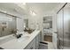 Bright bathroom with a double sink vanity, modern fixtures, and separate shower and toilet rooms at 1720 Highpoint St, Wake Forest, NC 27587