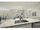 A granite countertop island overlooks the living room and an open concept living space at 1720 Highpoint St, Wake Forest, NC 27587