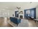 Inviting living room boasts a cozy fireplace, modern ceiling fan, and stylish decor for comfortable living at 1720 Highpoint St, Wake Forest, NC 27587