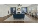 Spacious living room with a cozy fireplace, ceiling fan, and stylish decor for comfortable living at 1720 Highpoint St, Wake Forest, NC 27587