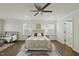 The Main Bedroom has hardwood floors and large windows for plenty of natural light at 1720 Highpoint St, Wake Forest, NC 27587