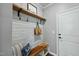 Mud room with a shiplap wall and a wooden bench and shelf at 1720 Highpoint St, Wake Forest, NC 27587