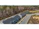 Community aerial showcasing attractive townhomes surrounded by beautiful natural scenery at 1805 Kauri Cliffs Dr, Fuquay Varina, NC 27526