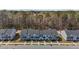 Attractive aerial shot of a townhome community surrounded by lush trees and greenery at 1805 Kauri Cliffs Dr, Fuquay Varina, NC 27526