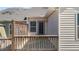 View of the home's back deck featuring a fenced-in portion and sliding glass doors at 1805 Kauri Cliffs Dr, Fuquay Varina, NC 27526