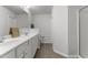 The primary bathroom has a double sink vanity and a walk-in shower at 1805 Kauri Cliffs Dr, Fuquay Varina, NC 27526