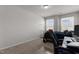 Bedroom with natural light features a bed, desk, and a work space at 1805 Kauri Cliffs Dr, Fuquay Varina, NC 27526