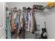 Walk-in closet with ample storage, hanging racks, and shelving at 1805 Kauri Cliffs Dr, Fuquay Varina, NC 27526