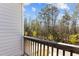 Balcony showcasing serene wooded views and a relaxing outdoor space at 1805 Kauri Cliffs Dr, Fuquay Varina, NC 27526