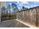 Wooden deck area perfect for outdoor relaxing and entertaining with a wooded backdrop at 1805 Kauri Cliffs Dr, Fuquay Varina, NC 27526